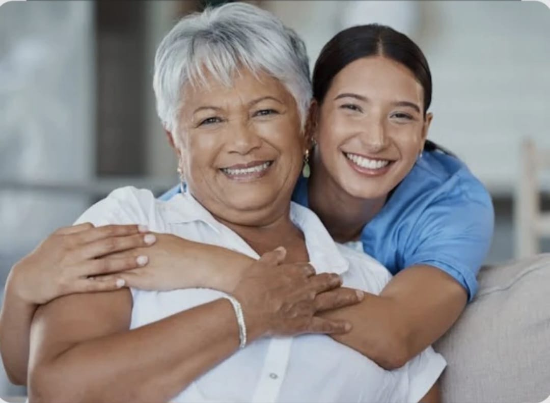 Caregiver providing friendly companionship to an older adult